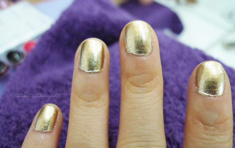I decided to get my nails done in a metallic gold color